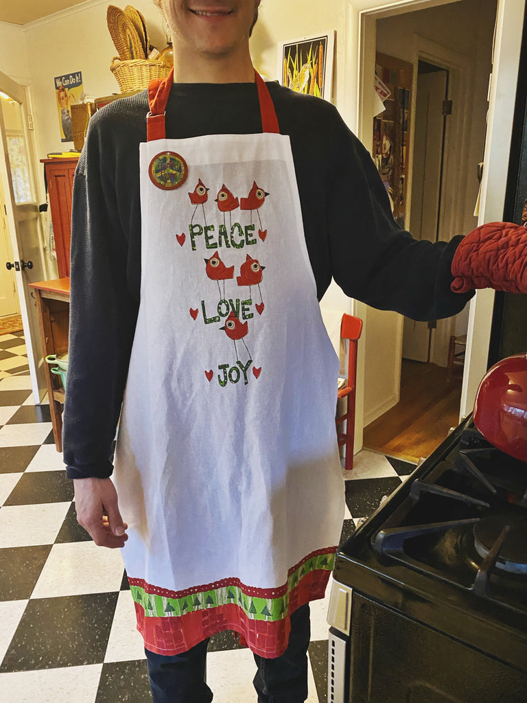 We got a cutie in an apron over here! Get yours and you can be a cutie in an apron too! 🧑‍🍳