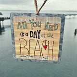 All You Need Is A Day At The Beach Tin Ornament